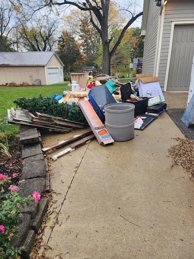 Dumpster being loaded with debris for 30 Yard Dumpster Rental in Summit Hill